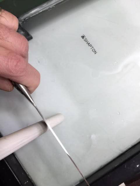 Honing a knife on a ceramic hone