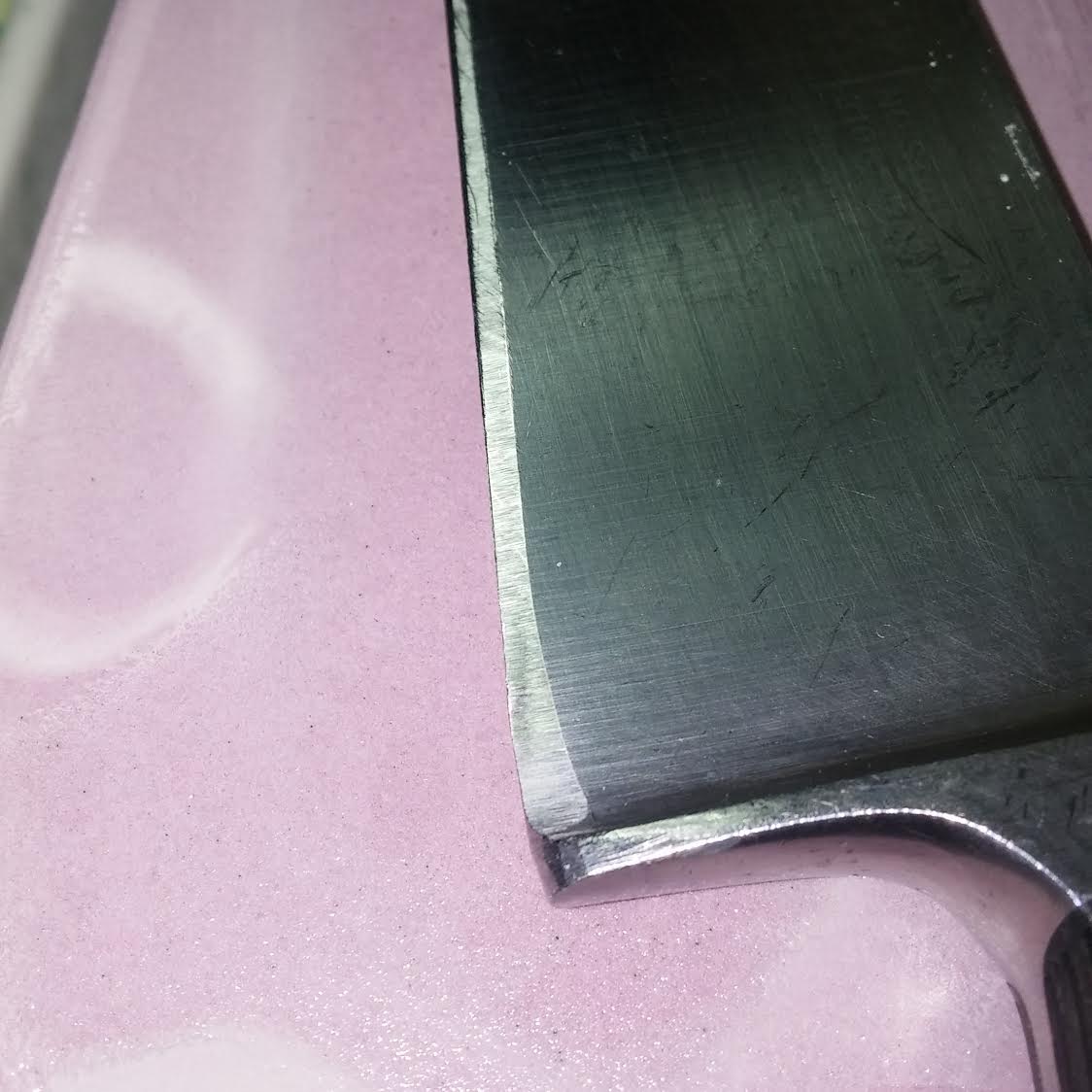 A clear indication of the damage a Grinder can do to a knife.